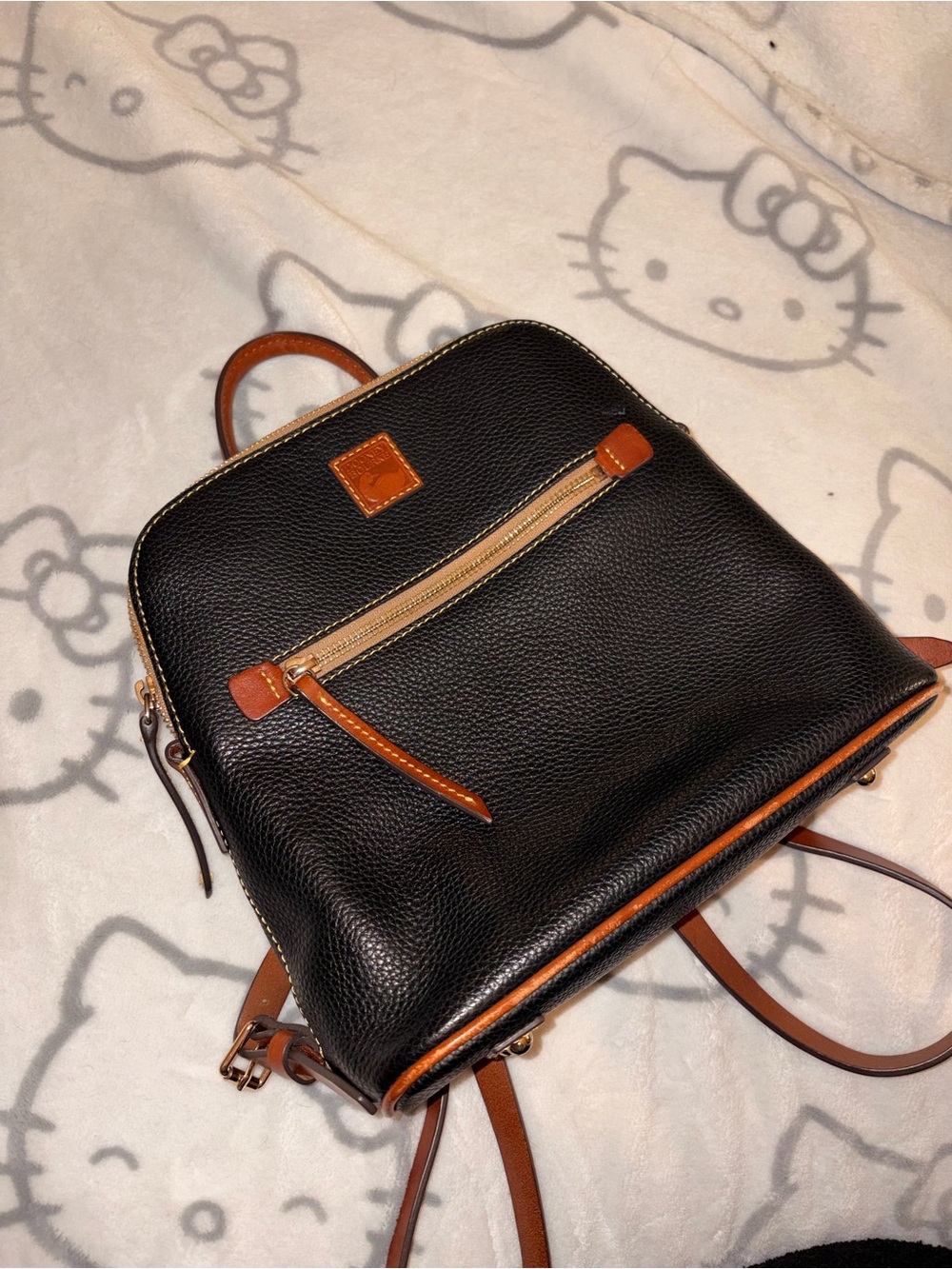 Dooney & Bourke vintage black pebbled leather with brown trim backpack / purse